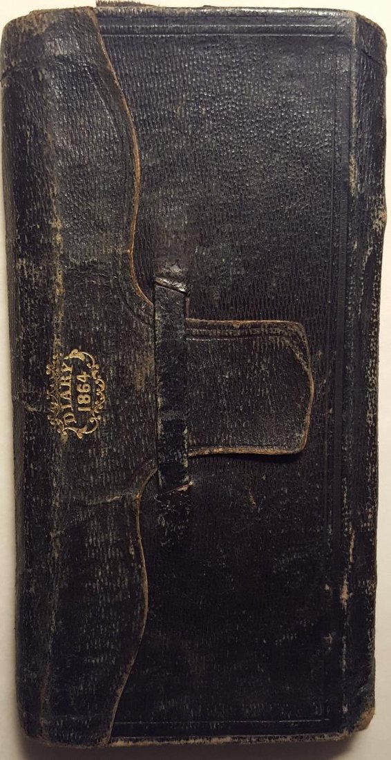 The worn leather cover of George Royal Comey&rsquo;s 1864 pocket diary, embossed with the word DIARY 1864
